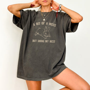 Cute bunny T-shirt featuring "A Bit Of A Mess, Doing My Best" design, perfect for a funny, aesthetic meme look.