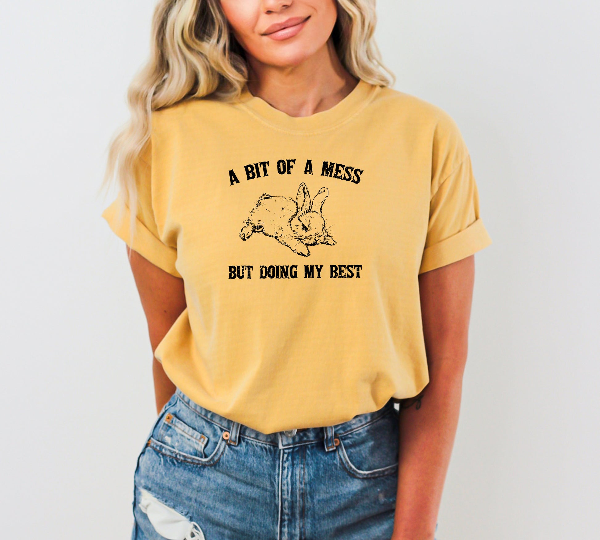 Cute bunny graphic t-shirt featuring the phrase "A Bit Of A Mess, Doing My Best" for a funny, aesthetic look.