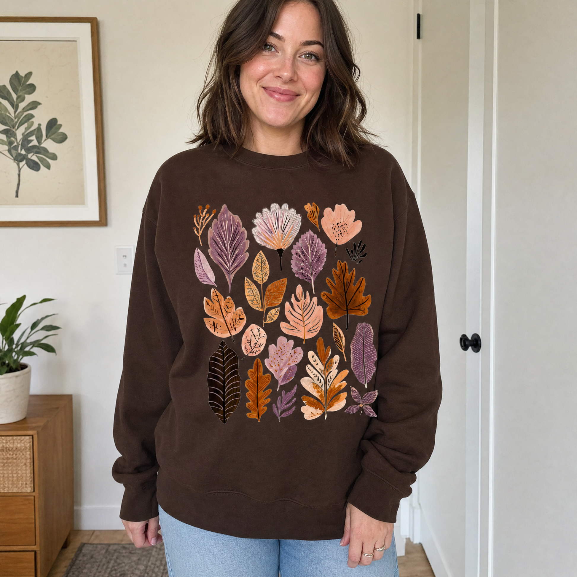 Model wearing the Abstract Autumn Leaves sweatshirt in Dark Chocolate
