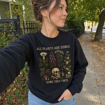 Model wearing the All Plants Edible sweatshirt in Black