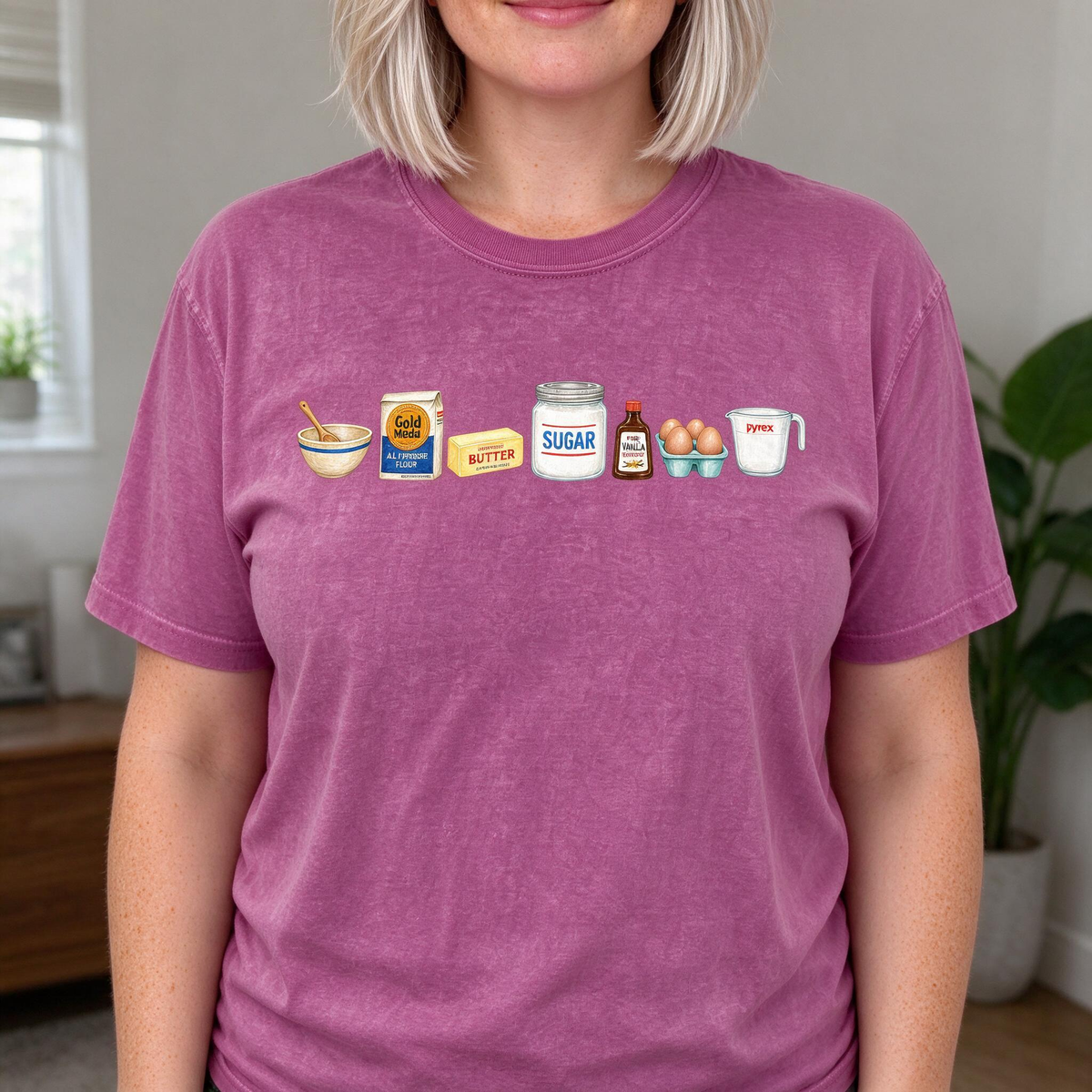 Model wearing the Baking Ingredients comfort colors tee in Berry