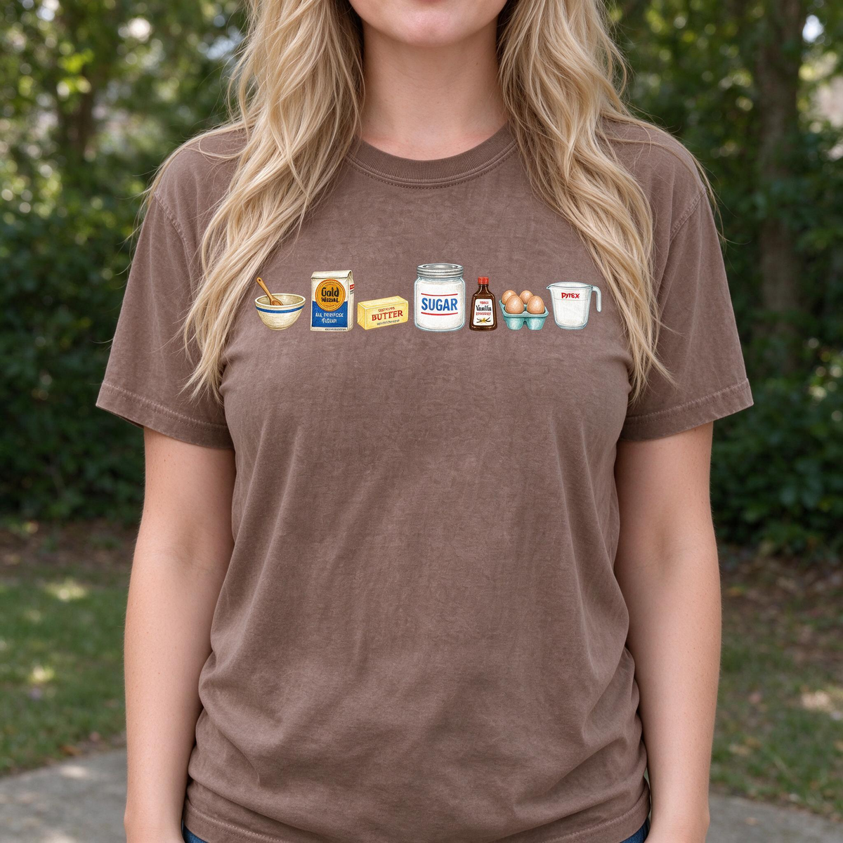 Model wearing the Baking Ingredients comfort colors tee in Espresso