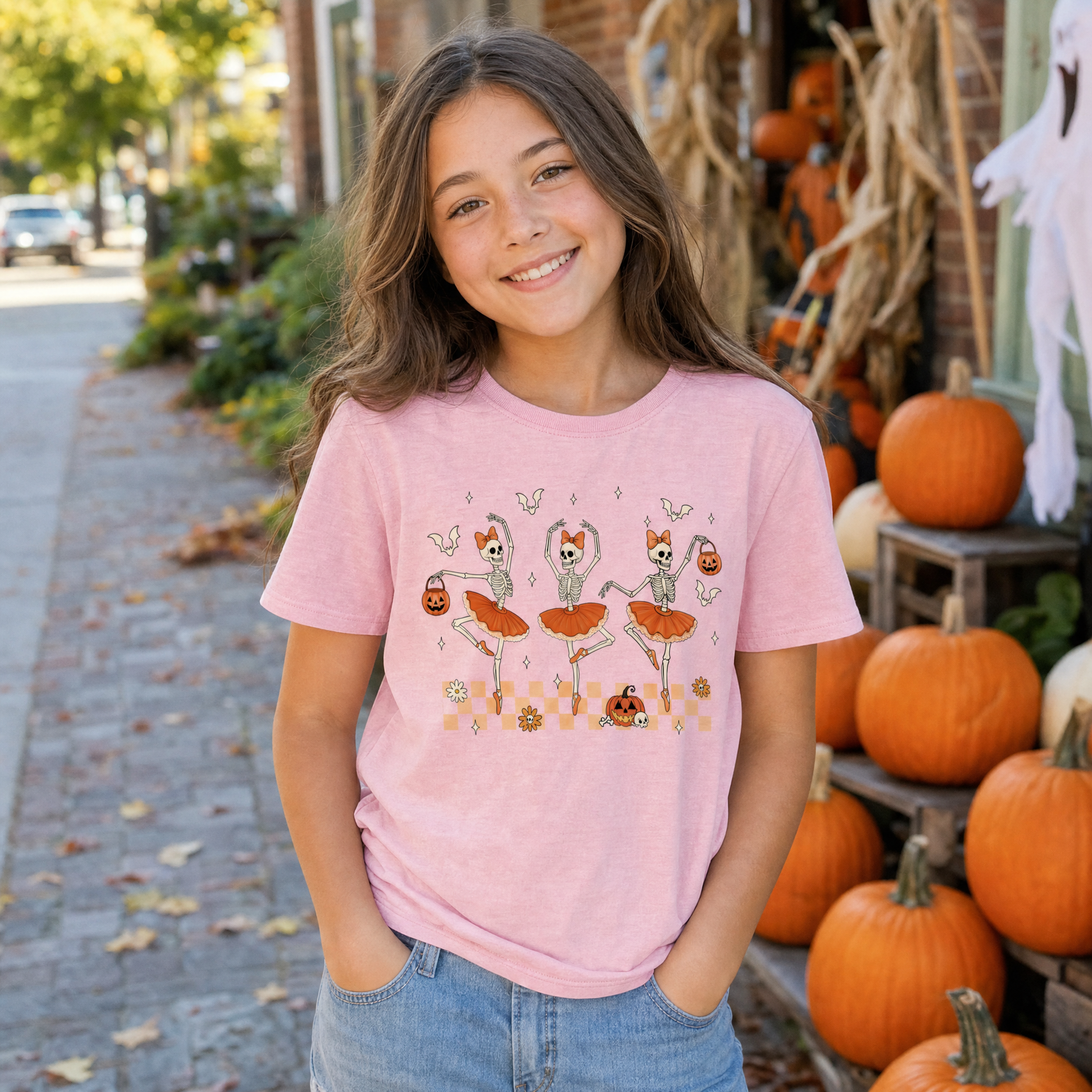 Model wearing the Ballerina Skeletons youth comfort colors tee in Blossom, lifestyle image 1