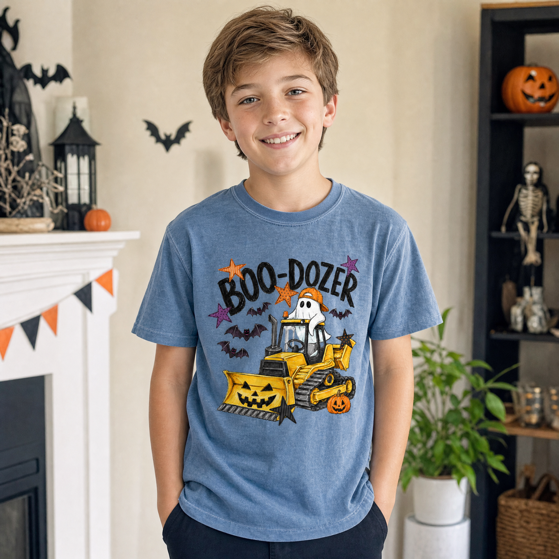 Model wearing the Boo-Dozer Ghost youth comfort colors tee in Blue Jean