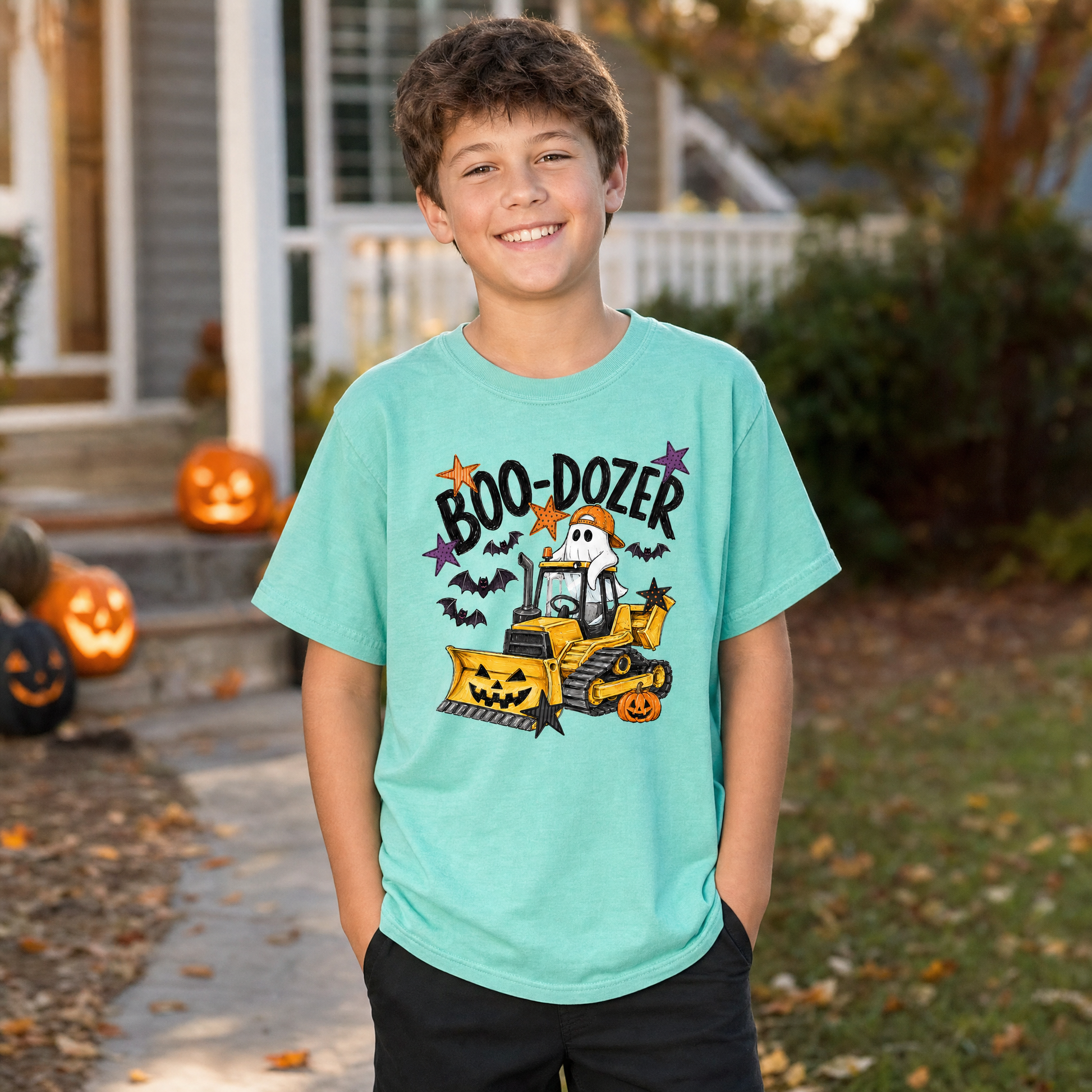 Model wearing the Boo-Dozer Ghost youth comfort colors tee in Island Reef, lifestyle image 1