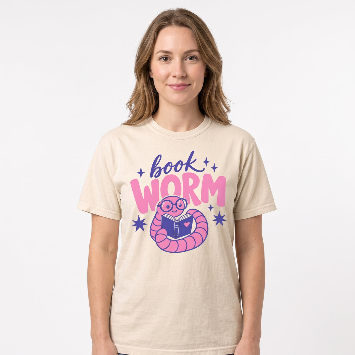 Model wearing the Book Worm comfort colors tee in Ivory, cover image 1