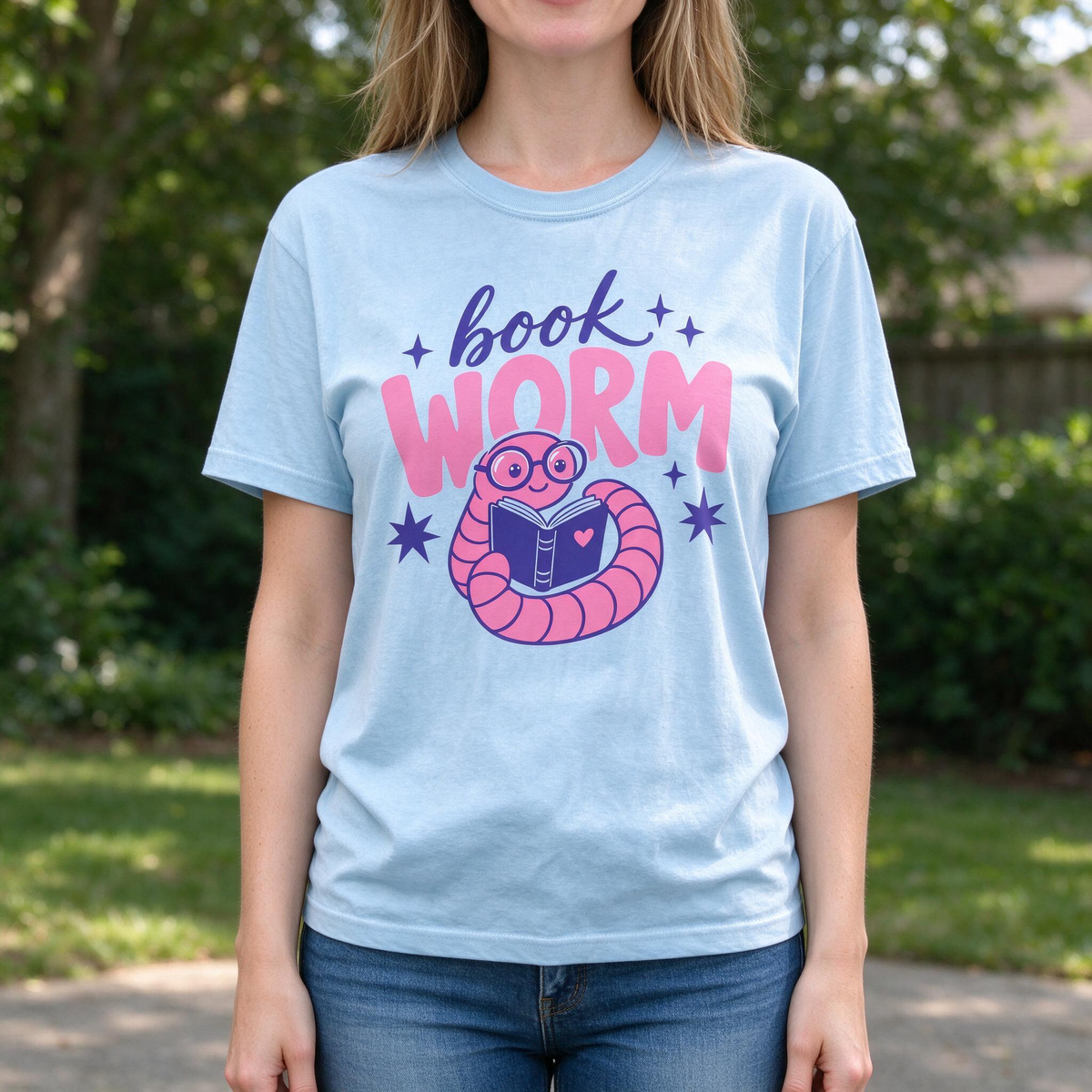 Model wearing the Book Worm comfort colors tee in Chambray