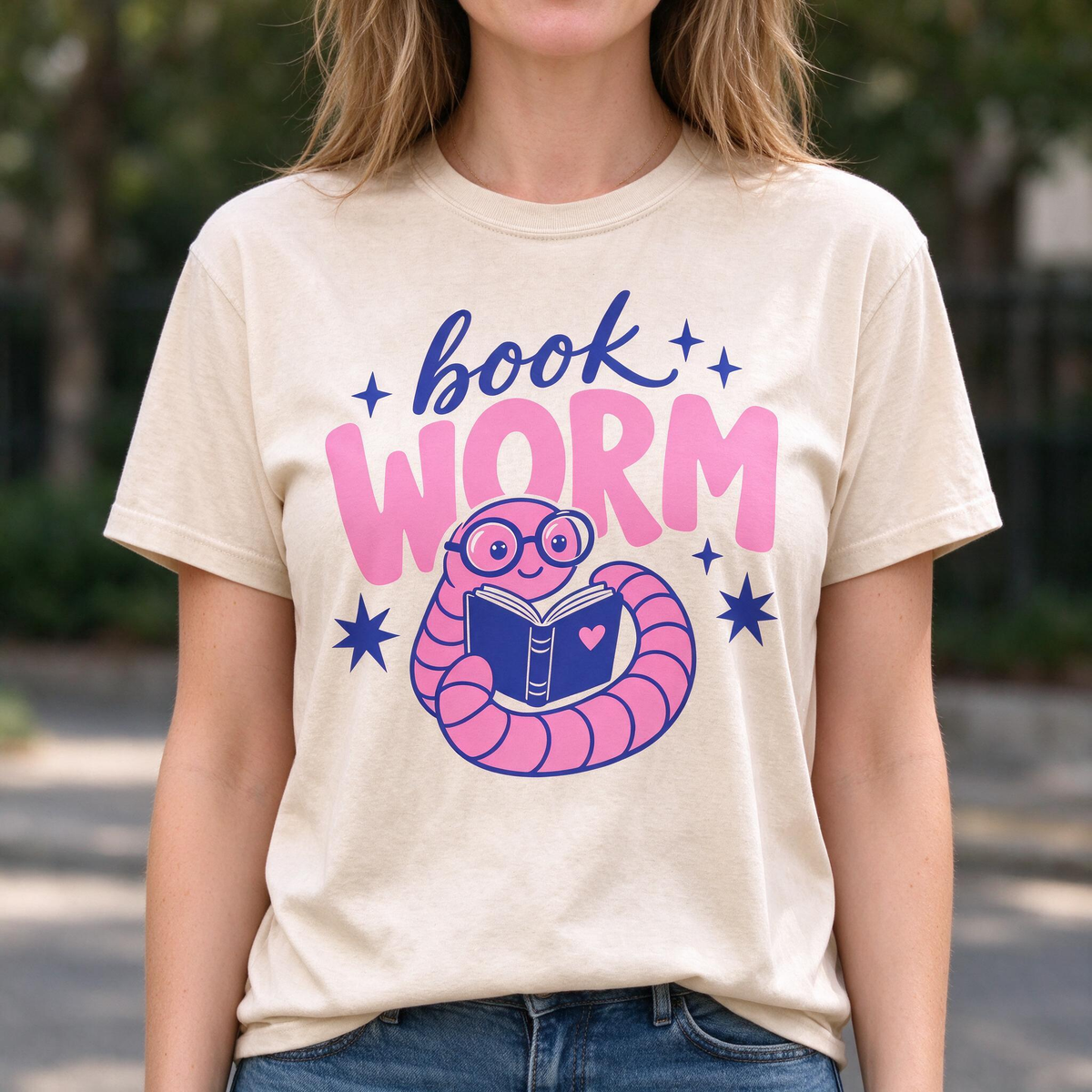 Model wearing the Book Worm comfort colors tee in Ivory, lifestyle image 1