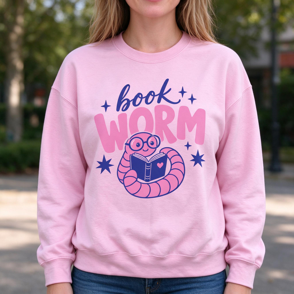 Model wearing the Book Worm sweatshirt in Light Pink
