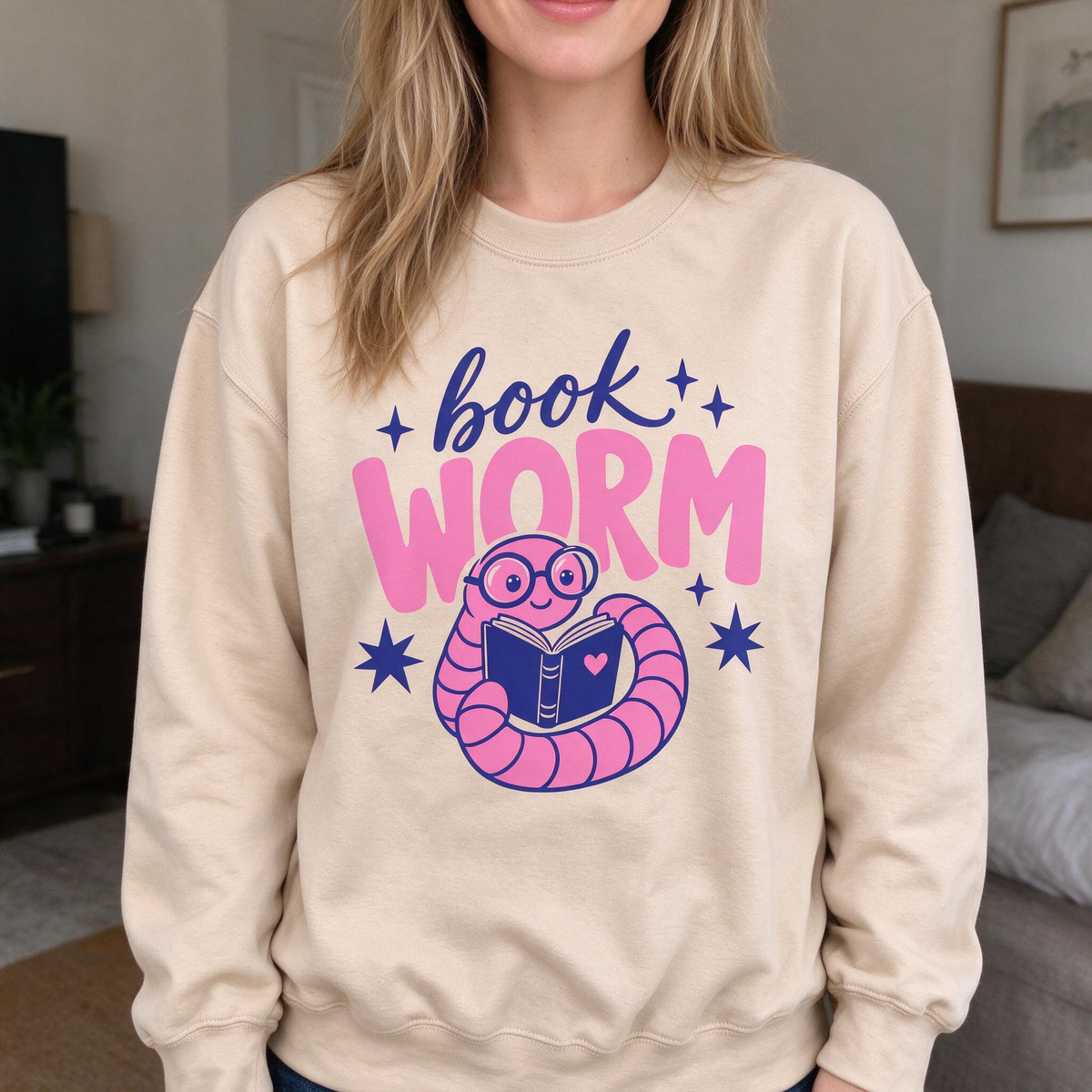 Model wearing the Book Worm sweatshirt in Sand