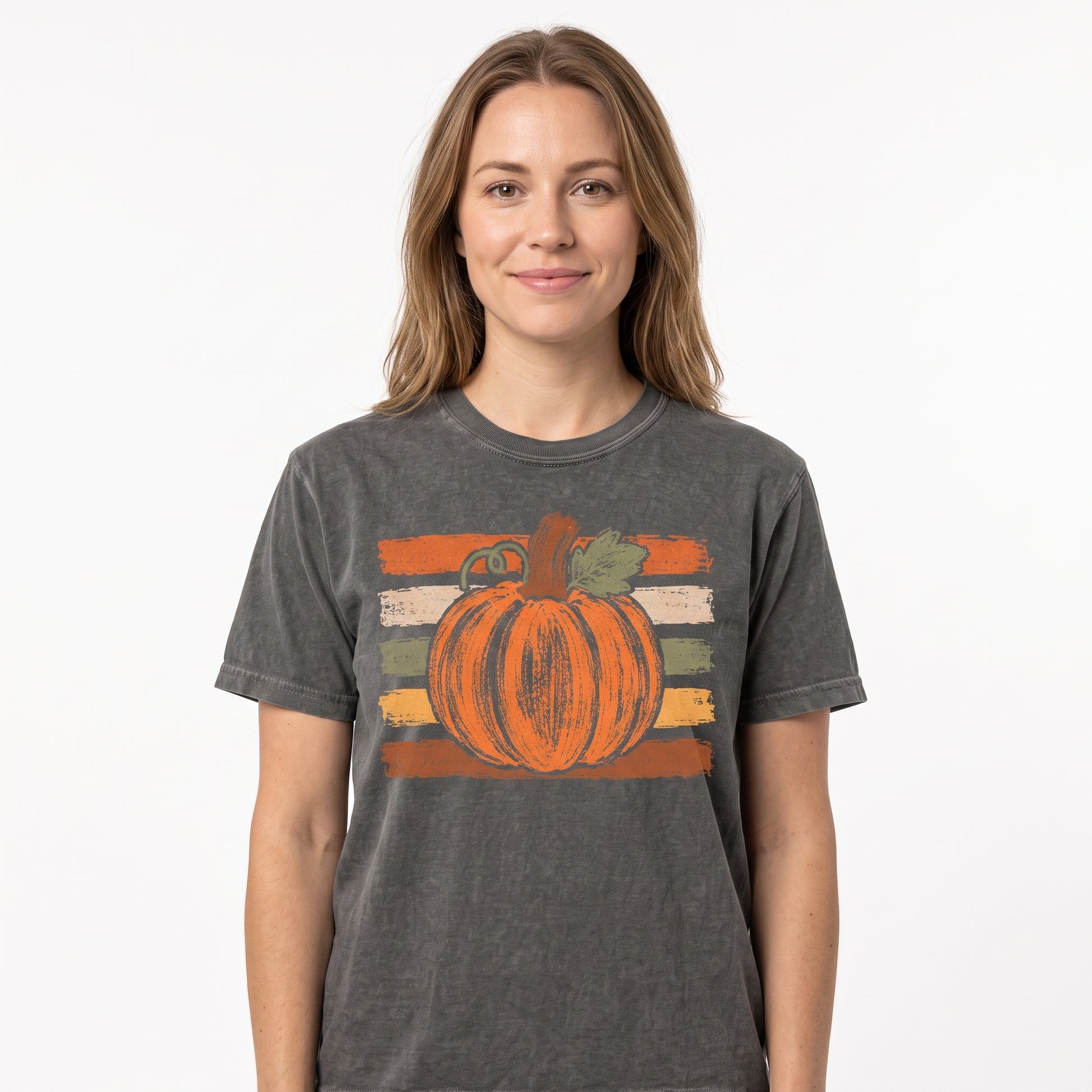 Model wearing the Brushstroke Pumpkin comfort colors tee in Pepper