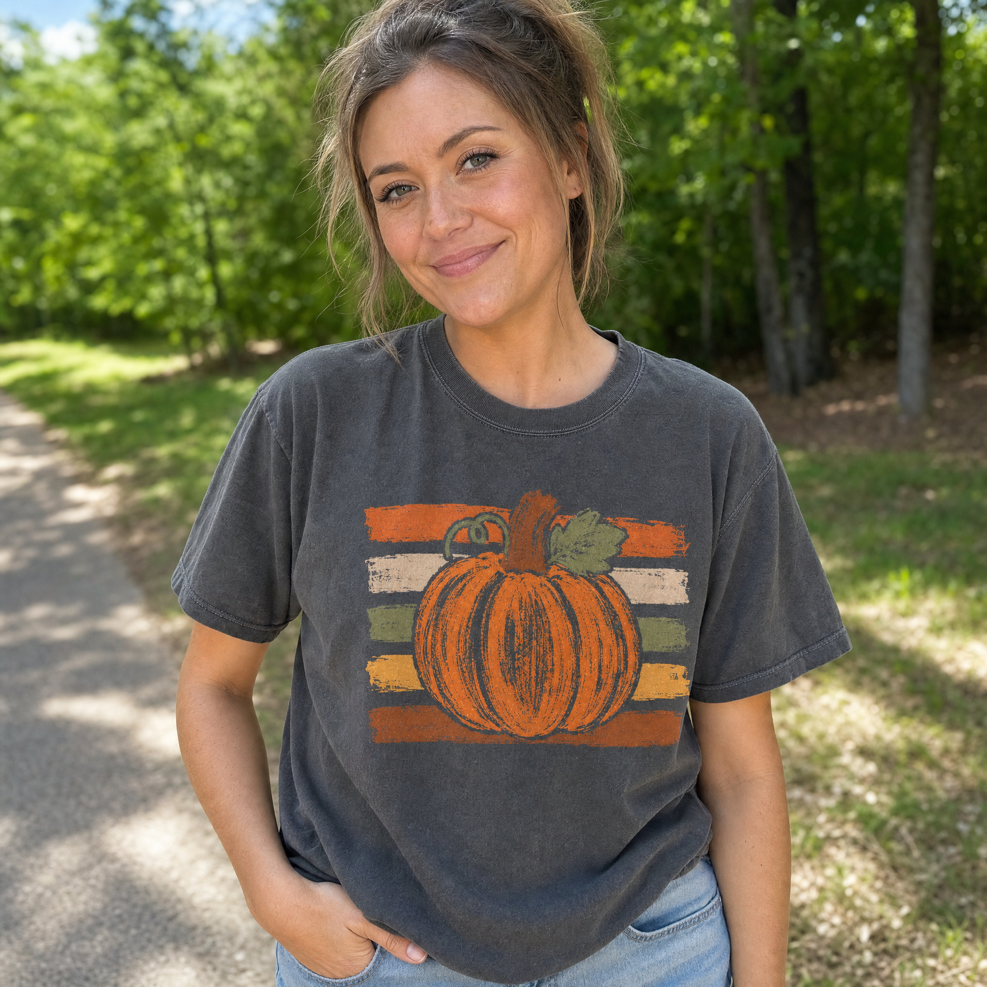 Model wearing the Brushstroke Pumpkin comfort colors tee in Pepper