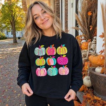 Model wearing the Brushstroke Pumpkins sweatshirt in Black