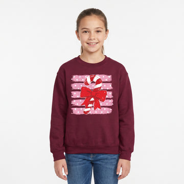 Model wearing the Candy Cane youth sweatshirt in Maroon, cover image 1