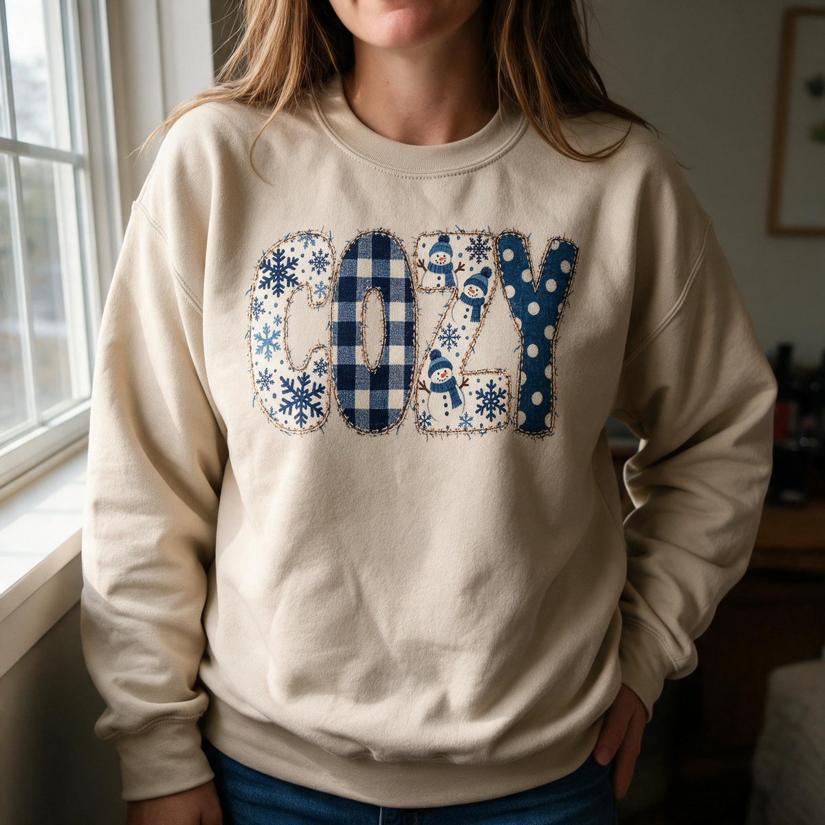 Model wearing the Cozy Snowmen sweatshirt in Sand