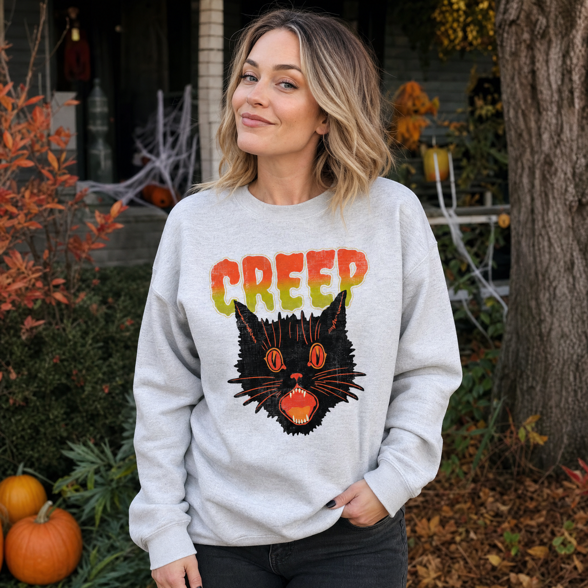 Model wearing the Creep Black Cat sweatshirt in Ash, lifestyle image 1