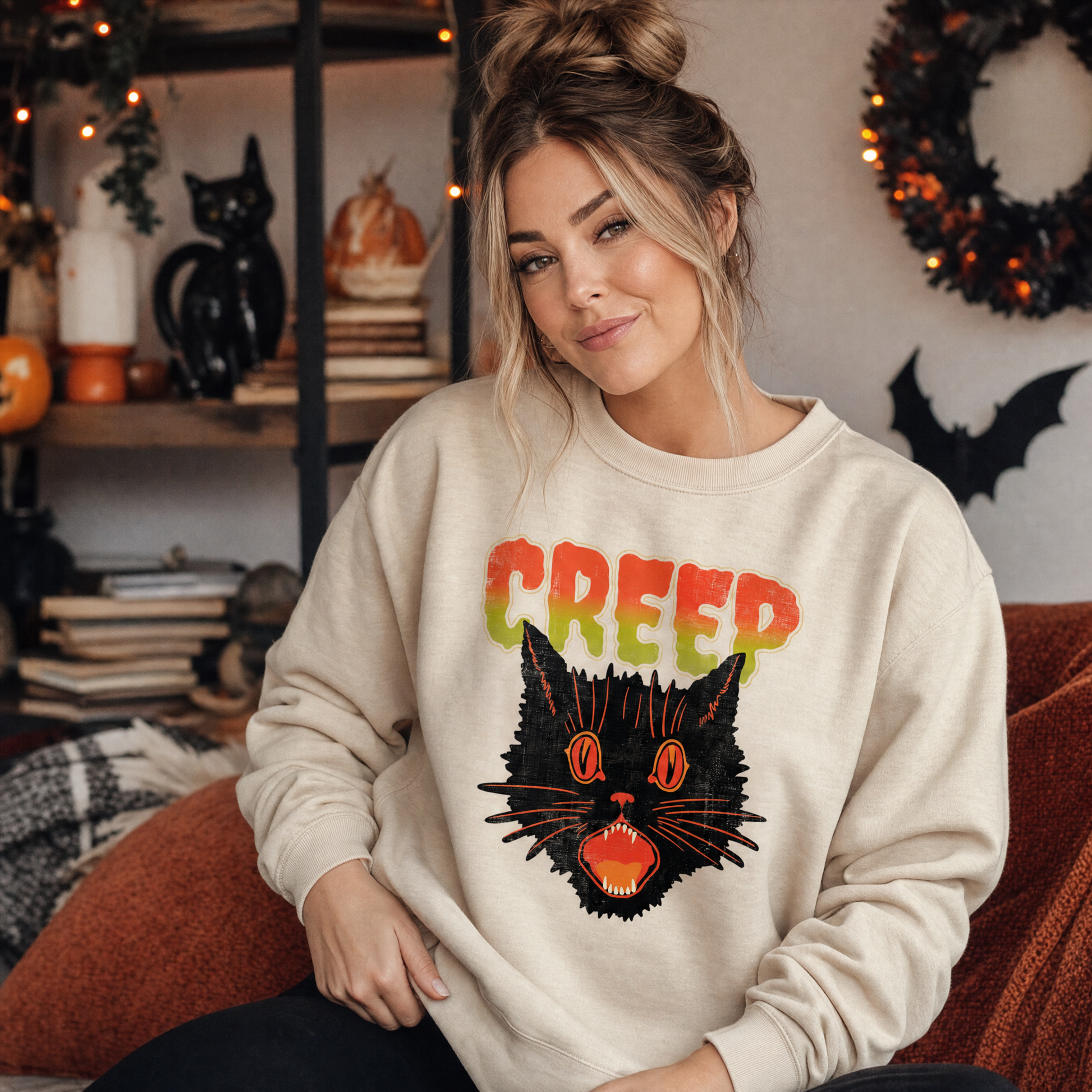Model wearing the Creep Black Cat sweatshirt in Sand