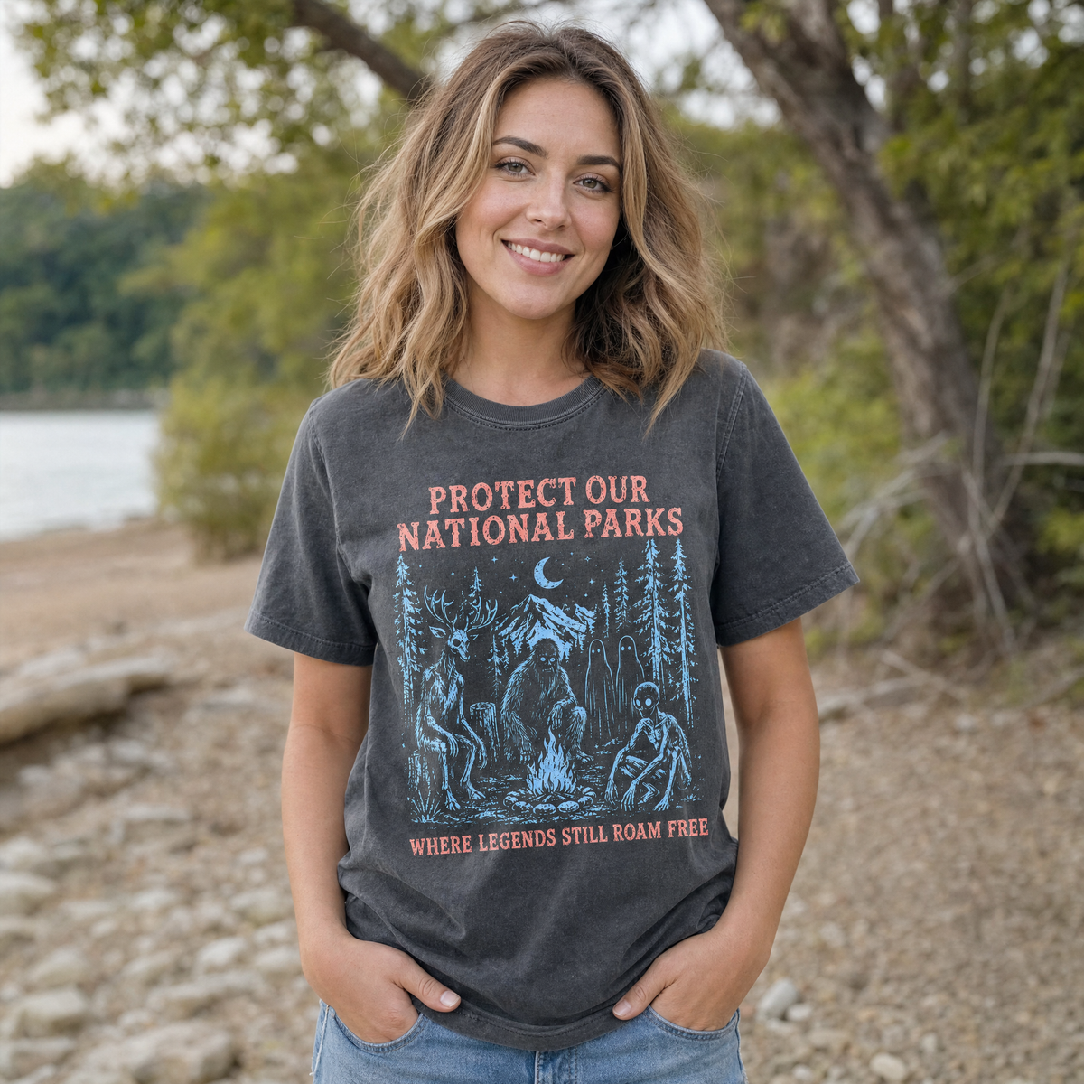 Model wearing the Cryptid Campfire comfort colors tee in Pepper, lifestyle image 1
