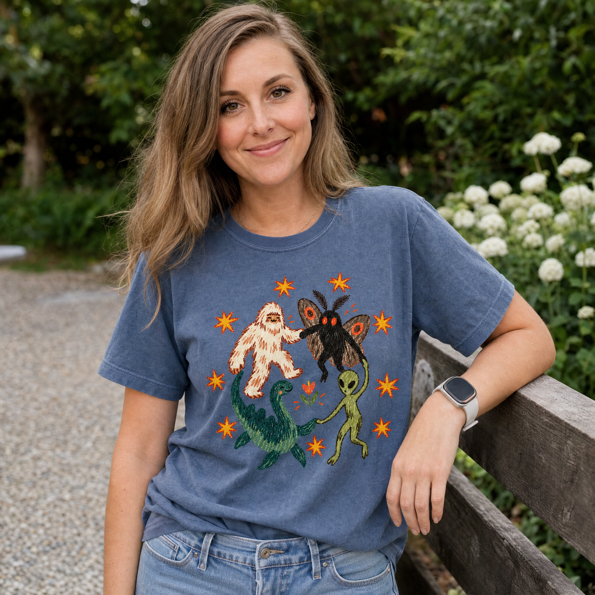 Model wearing the Cryptid Dance Party comfort colors tee in Denim