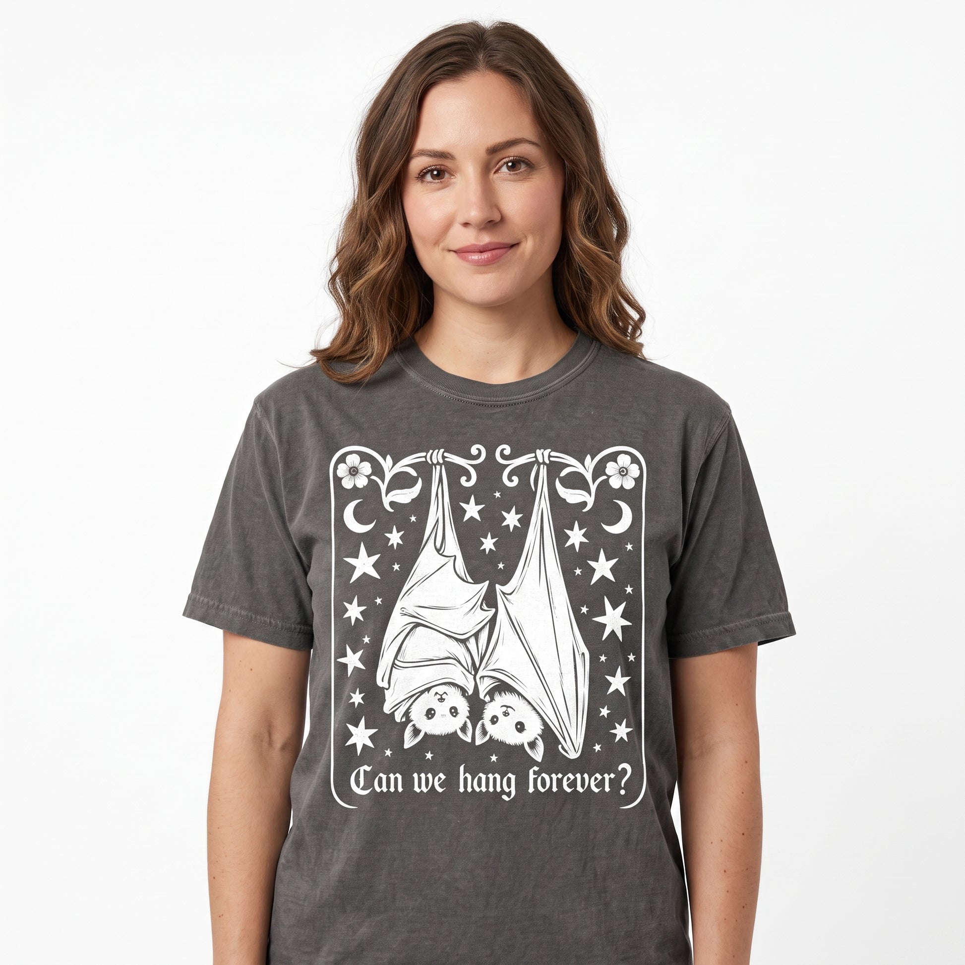 Model wearing the Cute Hanging Bats comfort colors tee in Pepper, cover image 1