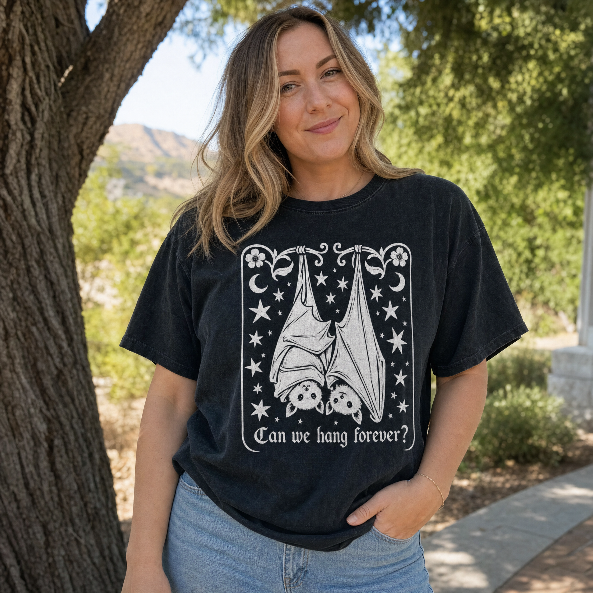 Model wearing the Cute Hanging Bats comfort colors tee in Black