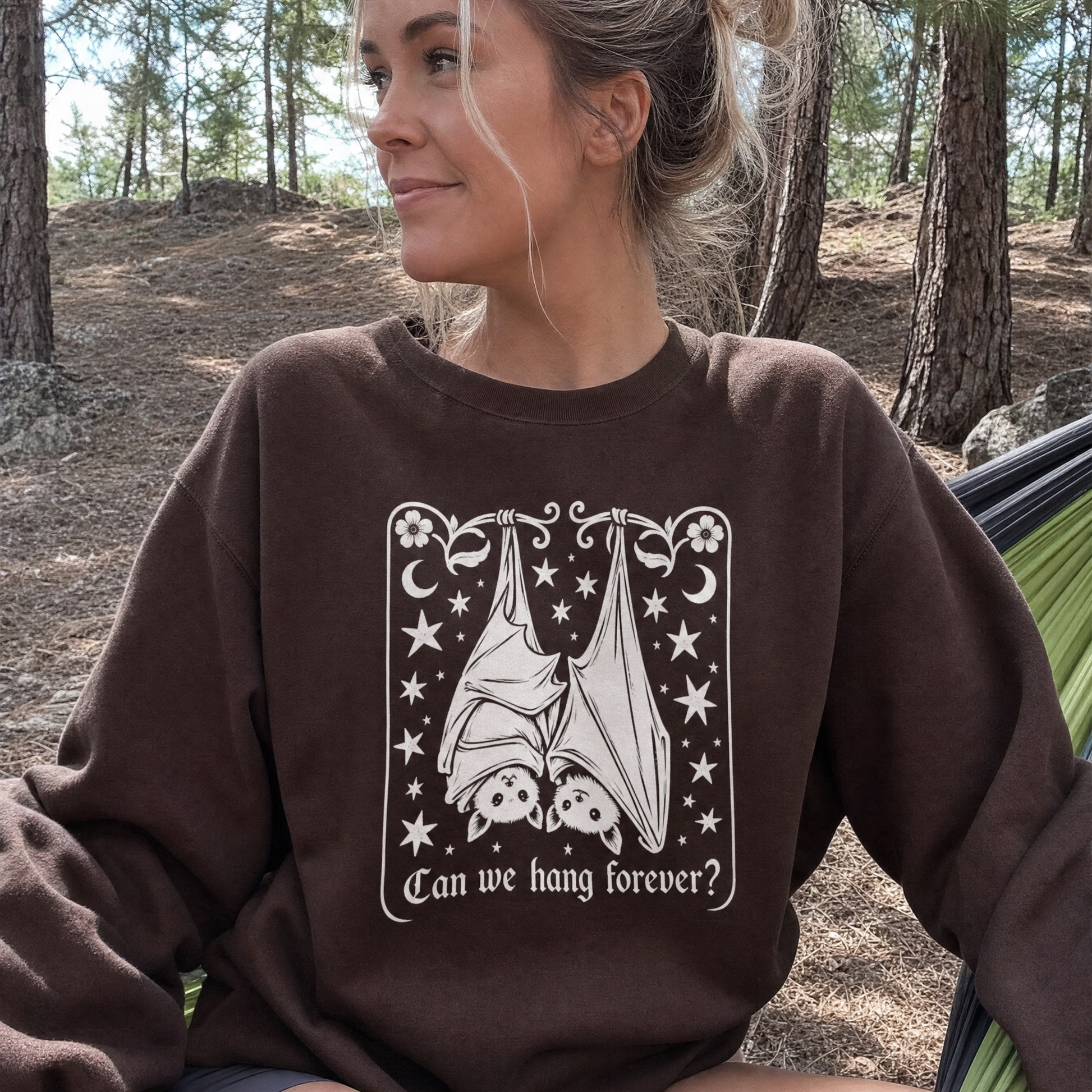 Model wearing the Cute Hanging Bats sweatshirt in Dark Chocolate