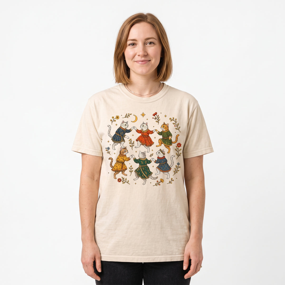 Model wearing the Dancing Medieval Cats comfort colors tee in Ivory, cover image 1