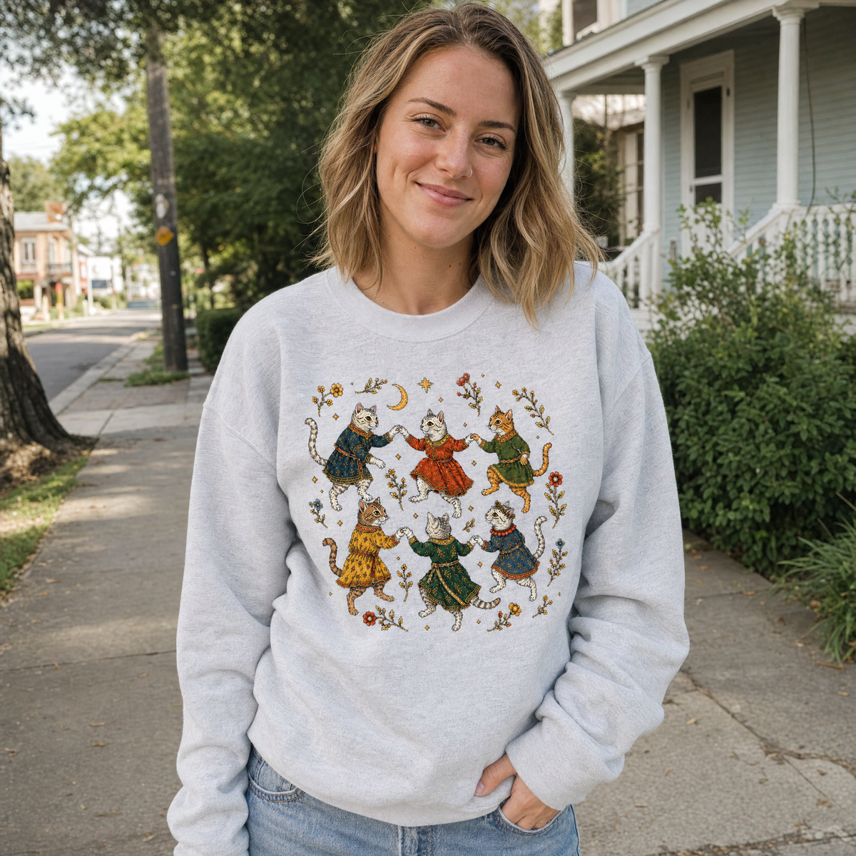 Model wearing the Dancing Medieval Cats sweatshirt in Ash, lifestyle image 1