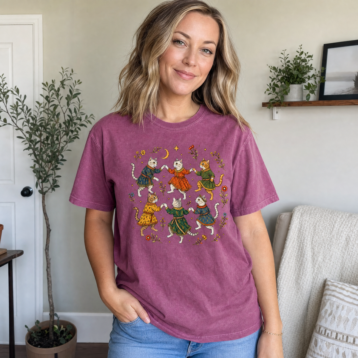 Model wearing the Dancing Medieval Cats comfort colors tee in Berry