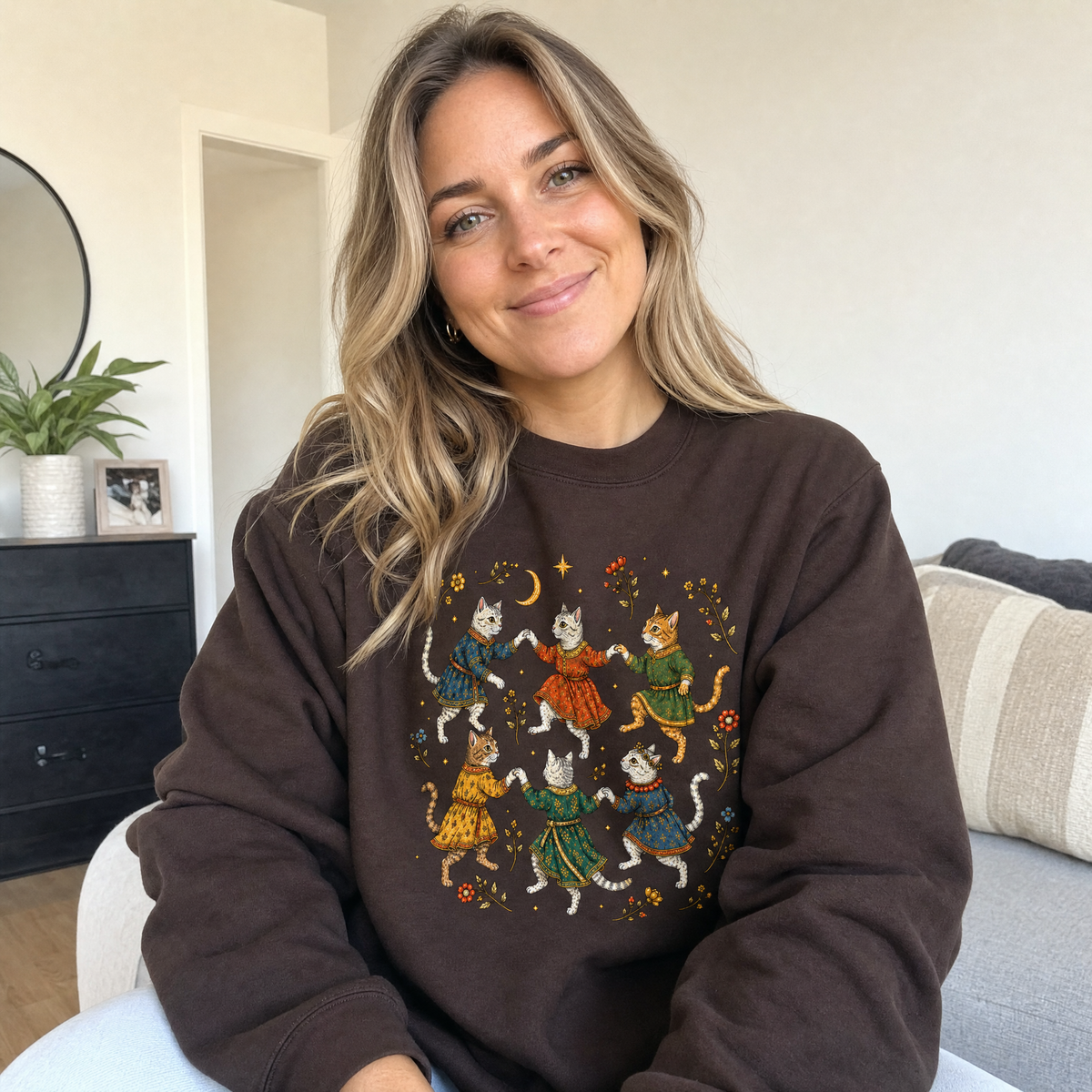 Model wearing the Dancing Medieval Cats sweatshirt in Dark Chocolate