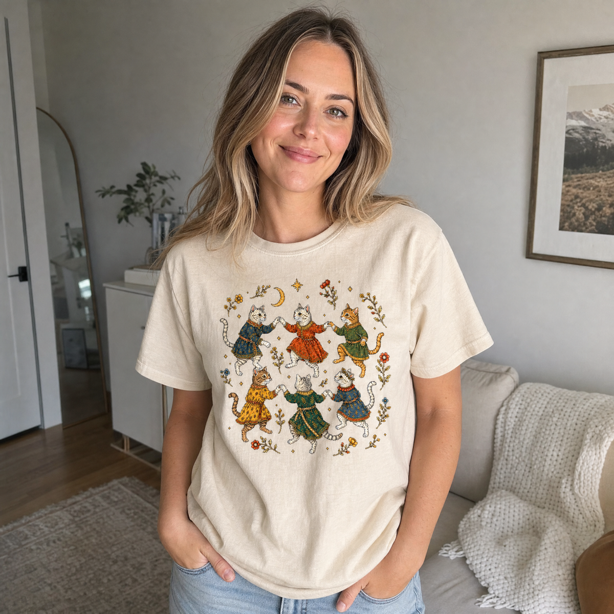 Model wearing the Dancing Medieval Cats comfort colors tee in Ivory, lifestyle image 1