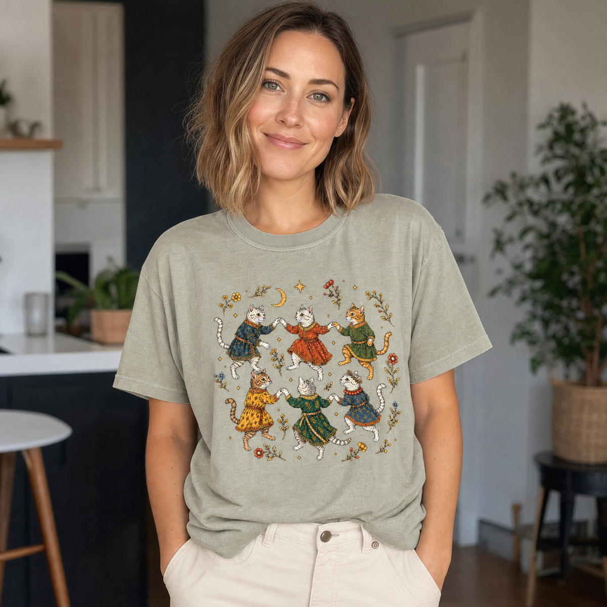 Model wearing the Dancing Medieval Cats comfort colors tee in Khaki