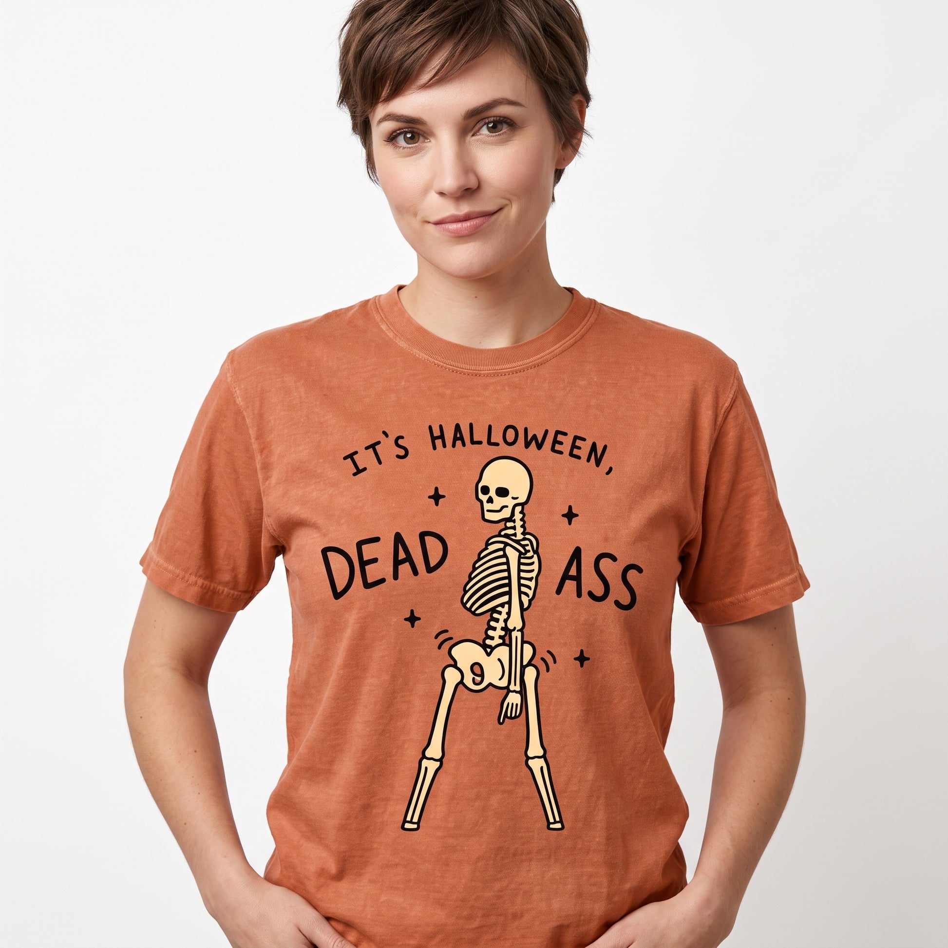 Model wearing the Dancing Skeleton comfort colors tee in Yam, cover image 1