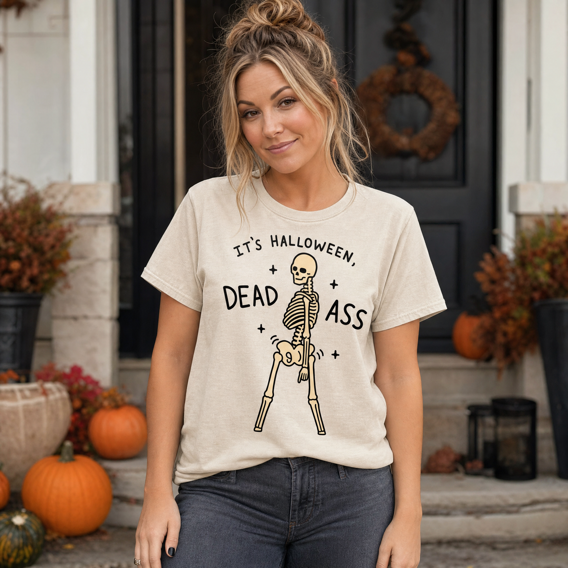 Model wearing the Dancing Skeleton comfort colors tee in Ivory