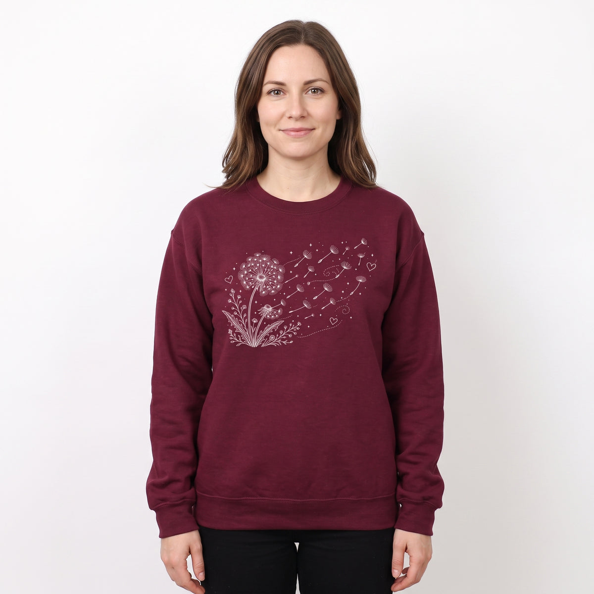Model wearing the Dandelion Blowing in the Wind sweatshirt in Maroon, cover image 1
