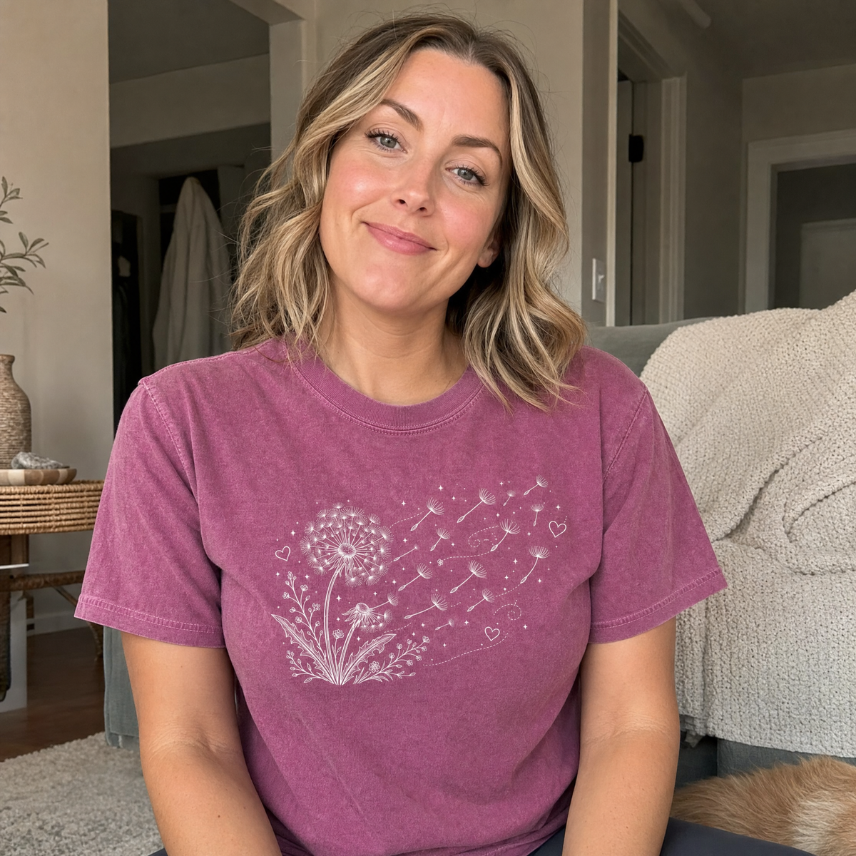 Model wearing the Dandelion Blowing in the Wind comfort colors tee in Berry, lifestyle image 1