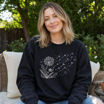 Model wearing the Dandelion Blowing in the Wind sweatshirt in Black