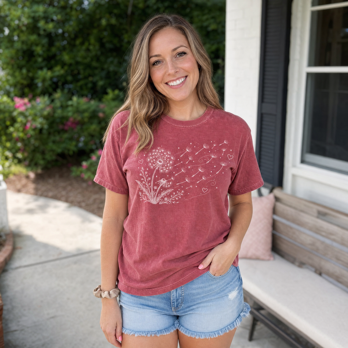 Model wearing the Dandelion Blowing in the Wind comfort colors tee in Brick