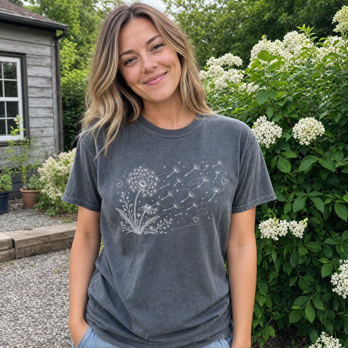 Model wearing the Dandelion Blowing in the Wind comfort colors tee in Pepper
