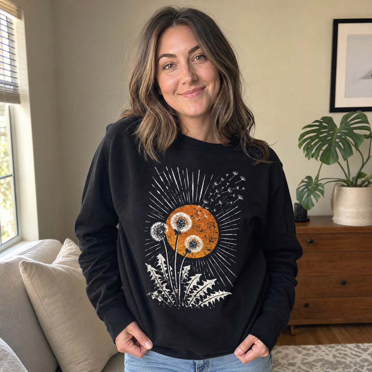Model wearing the Dandelion Seeds sweatshirt in Black, lifestyle image 1
