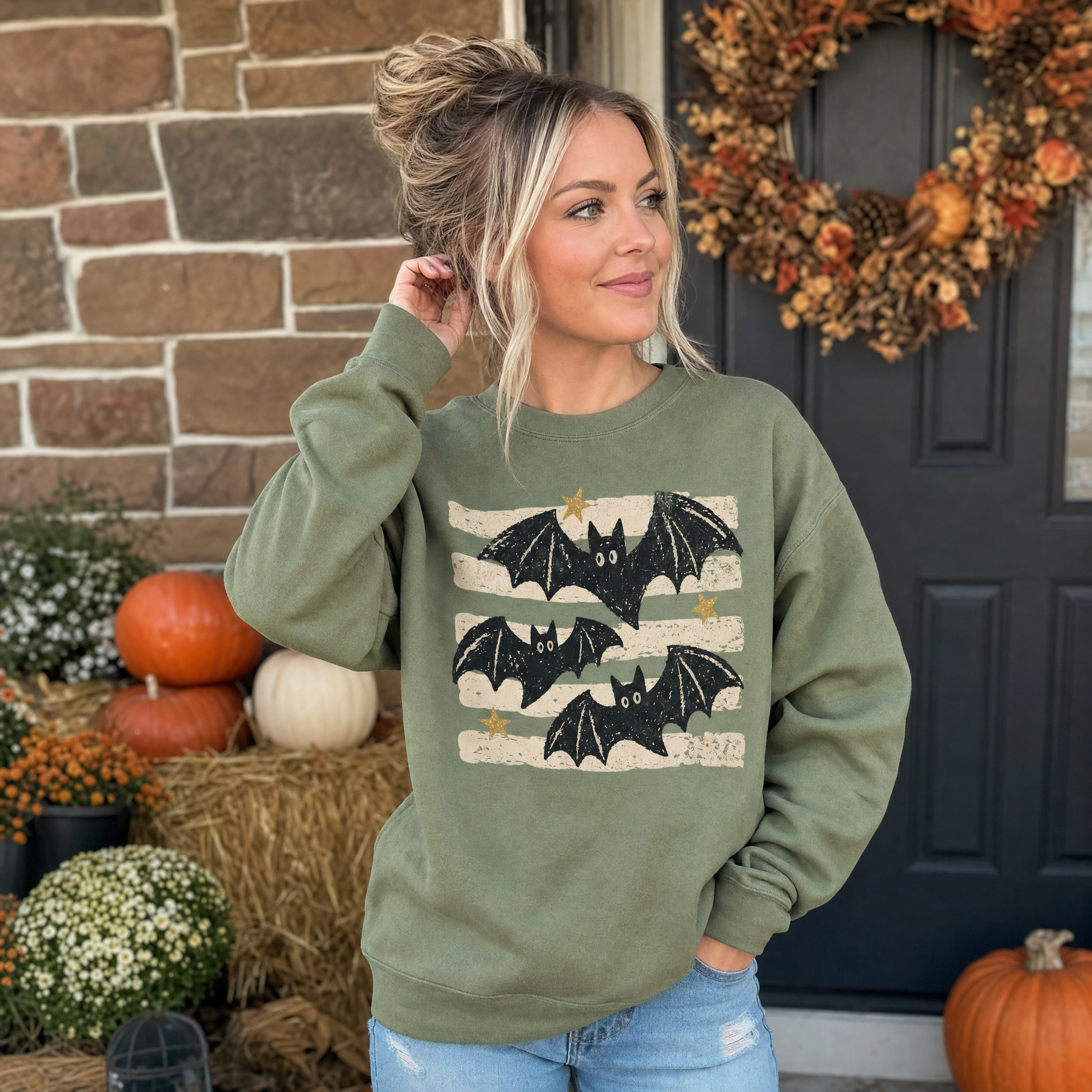 Model wearing the Distressed Bats sweatshirt in Military Green