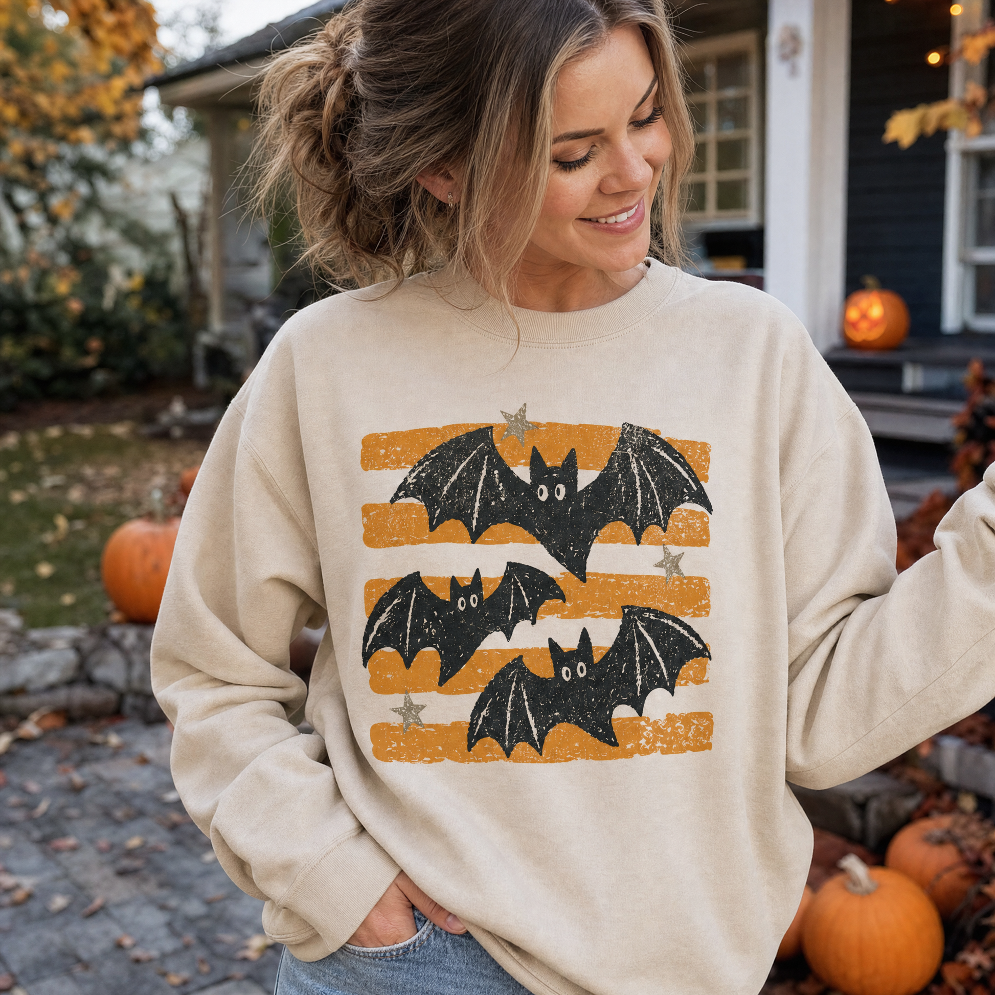 Model wearing the Distressed Bats sweatshirt in Sand