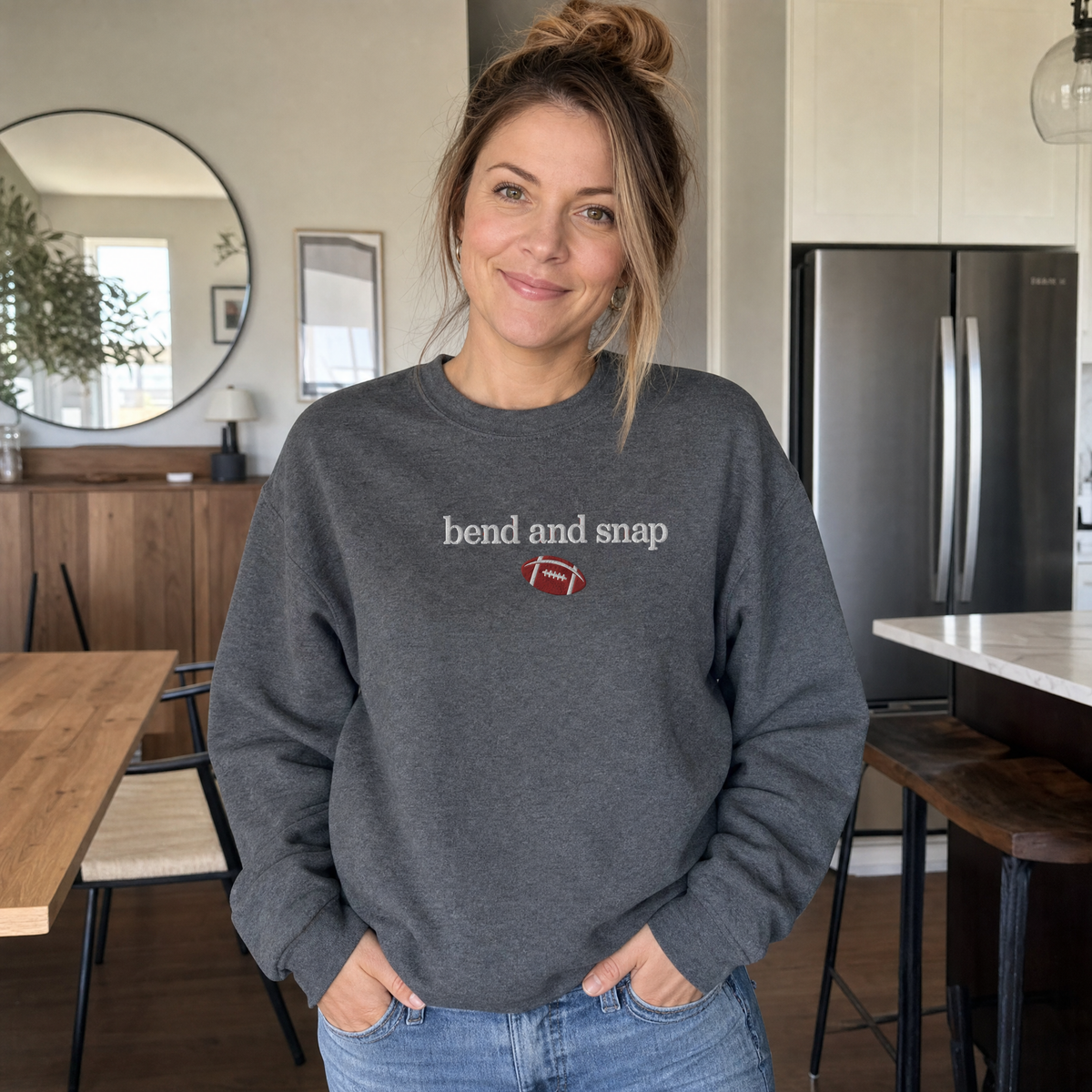Model wearing the Bend and Snap sweatshirt in Dark Heather, lifestyle image 1