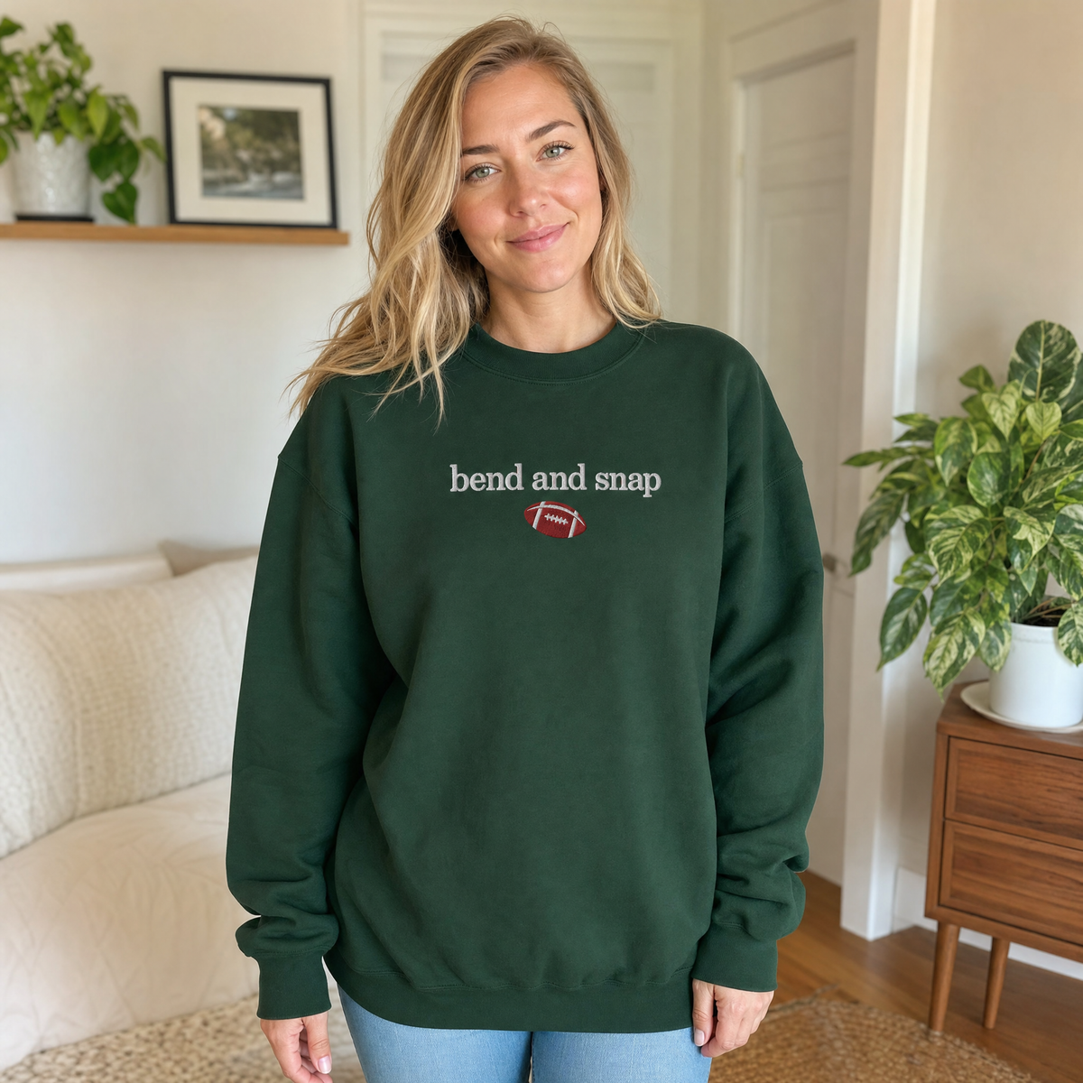 Model wearing the Bend and Snap sweatshirt in Forest Green, lifestyle image 1