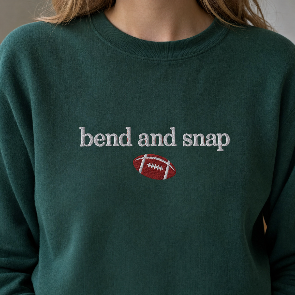 Model wearing the Bend and Snap sweatshirt in Forest Green, lifestyle image 2