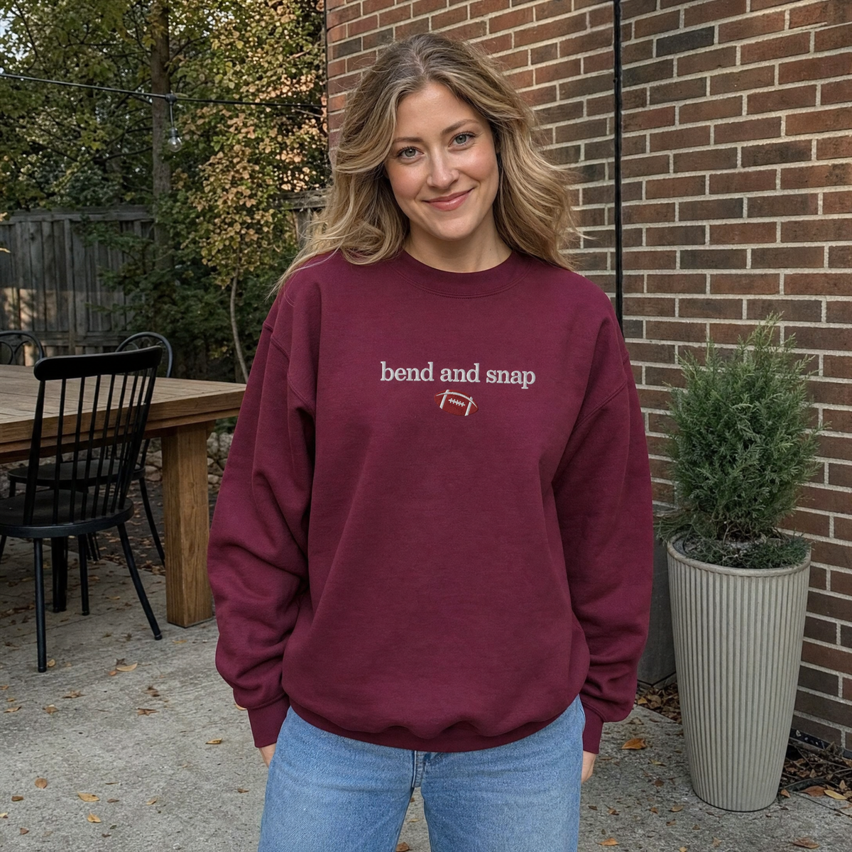 Model wearing the Bend and Snap sweatshirt in Maroon, lifestyle image 1