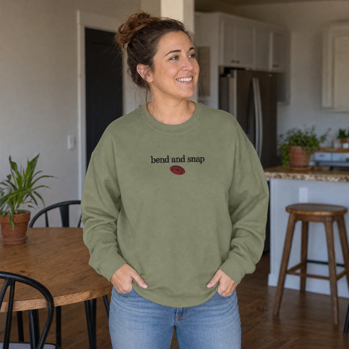 Model wearing the Bend and Snap sweatshirt in Military Green, lifestyle image 1