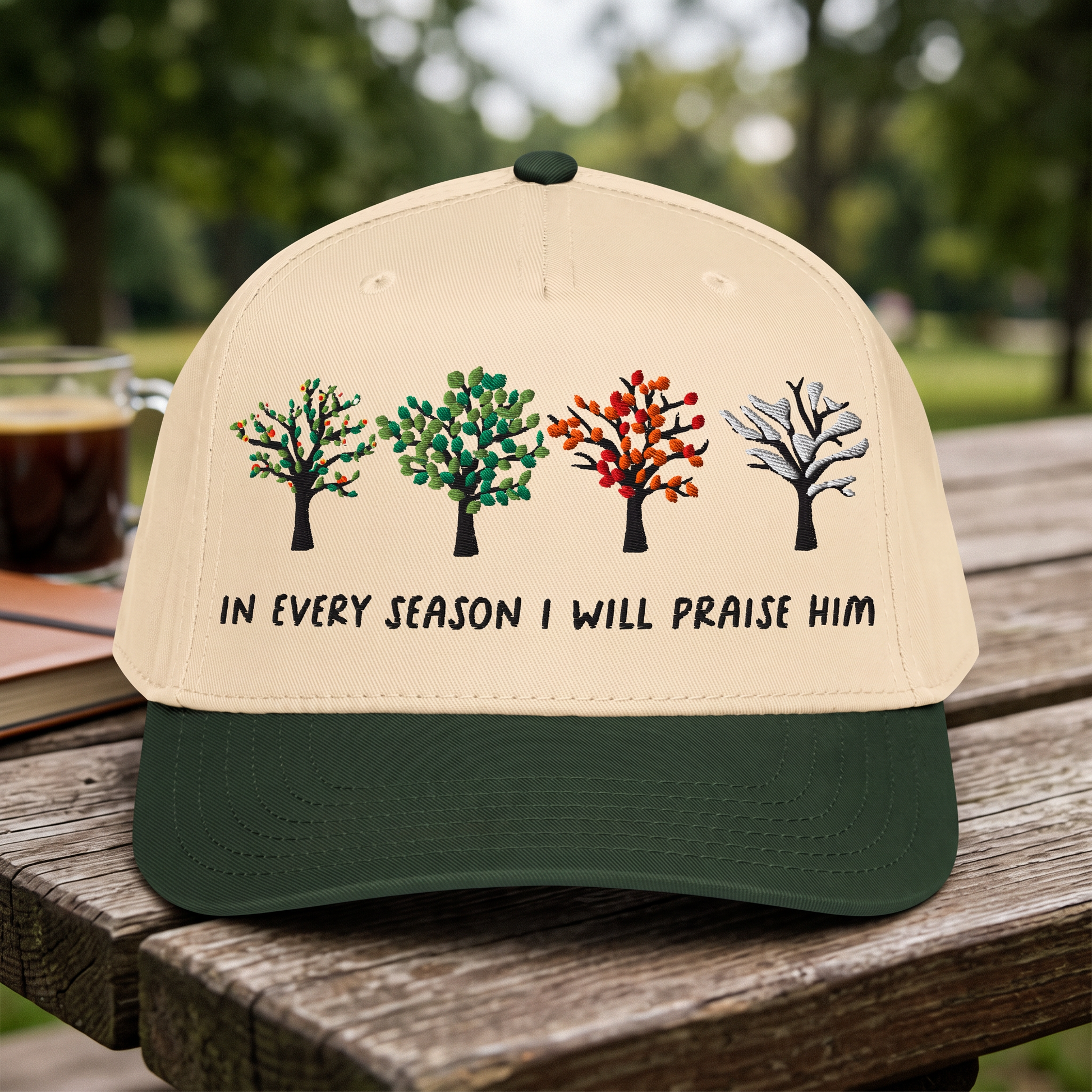 Bible Verse Quote embroidered hat in Dark Green/natural resting on a flat surface