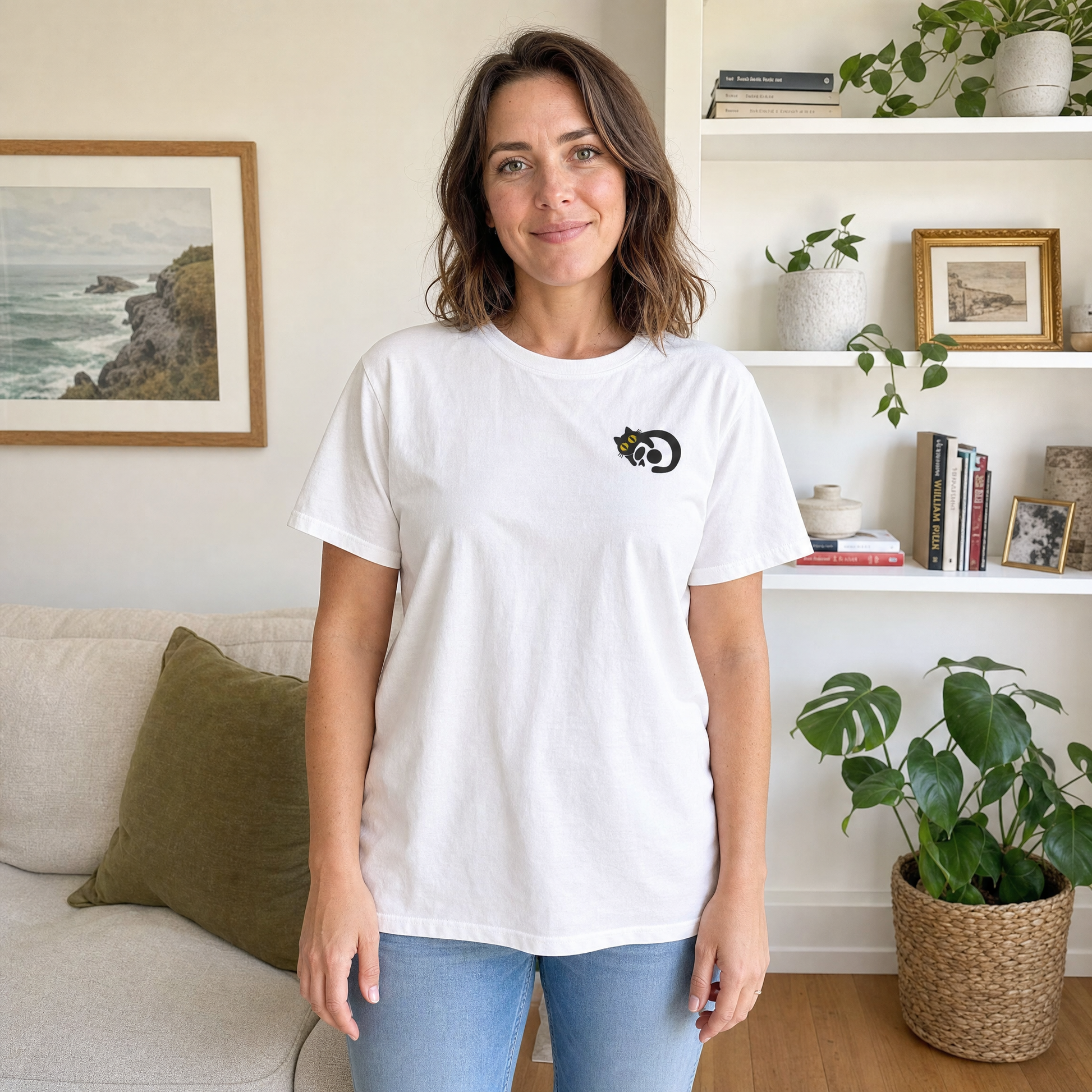 Model wearing the Black Cat Skull comfort colors tee in White, lifestyle image 1