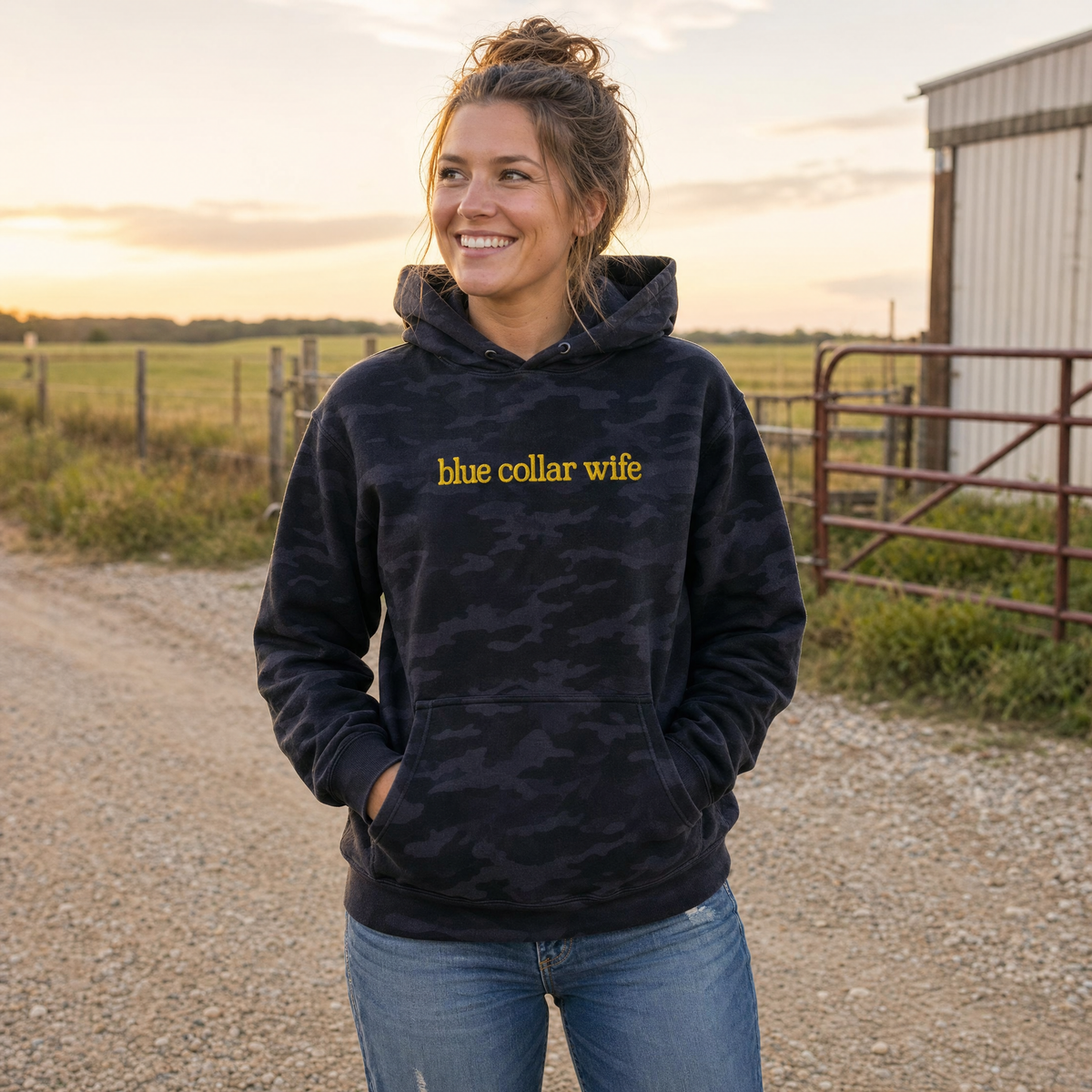 Model wearing the Blue Collar Wife heavyweight hoodie in Black Camo, lifestyle image 1